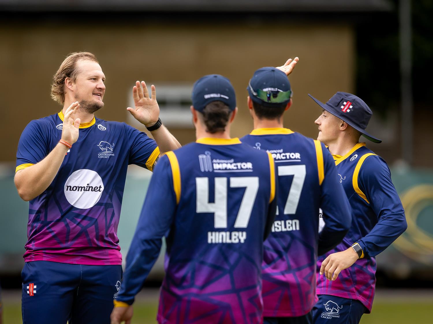 Oxfordshire's Hayden Rossouw (left) is congratulated by team mates after taking two wickets in two balls during the NCCA NV Play Trophy Quarter Final against Wiltshire at Warminster Cricket Club on June 7th, 2026.