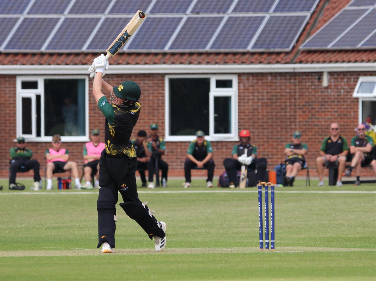 Lincolnshire v Cambridgeshire, NCCA T20 Group 2 match, held at Barton Town CC on 21/06/2026 .
Joe Pocklington hits straight, watched by his Lincolnshire teammates.