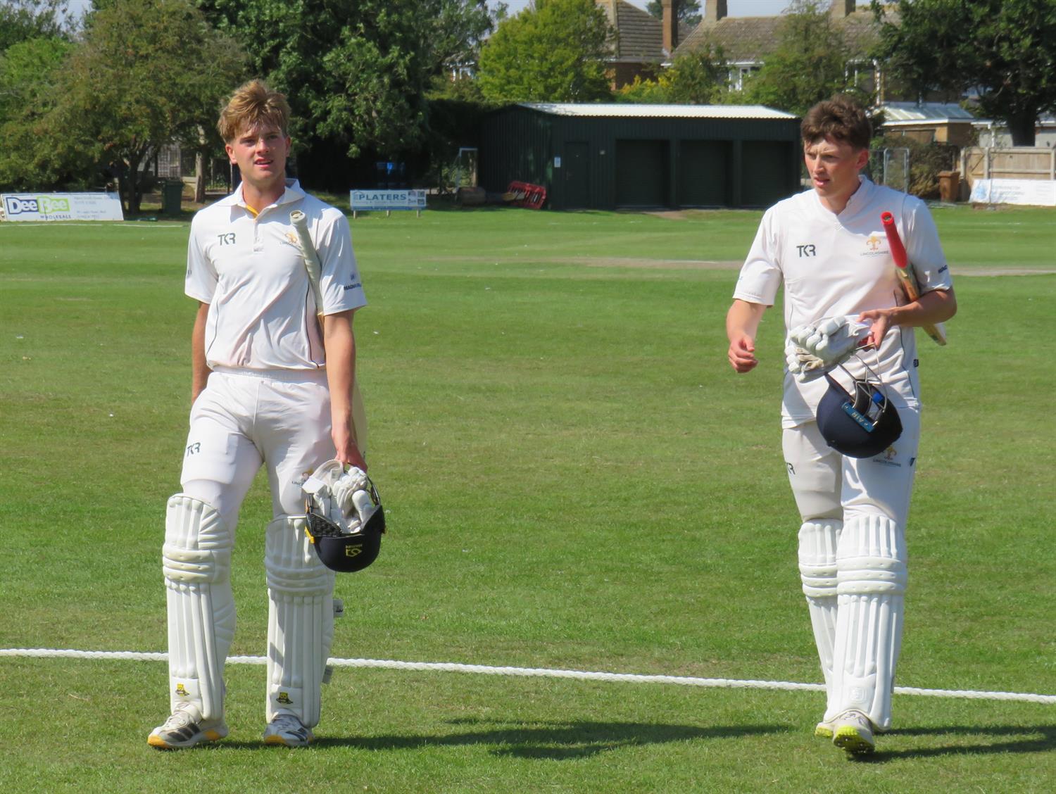 Lincolnshire v Cumbria, NCCA Cluberly Eastern Div 2 match, held at Cleethorpes on 23/08/2026 .
Tom Currie (left) and Tom Shephard (right) leave the field at the end of the Lincolnshire innings having shared a vital 35 run partnership. 