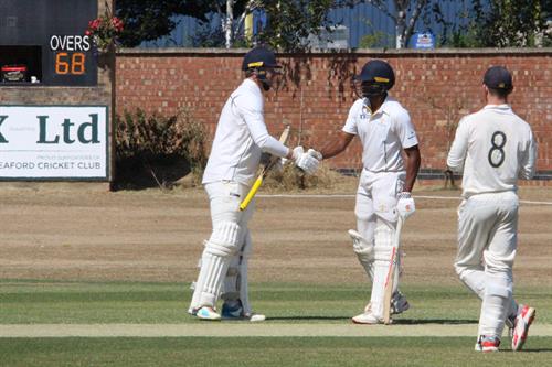 Lincolnshire v Norfolk, NCCA Cluberly Eastern Div 2 match, held at SLEAFORD C C  on 12/07/2026 .
Jordan Cook celebrates his 50 with Pranav Pothula of Lincolnshire C.C.C.