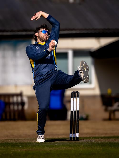 Harry Passenger bowling for Devon in the NCCA Dojo T20 Super 12s Final against Buckinghamshire at Exeter Cricket Club on August 9th, 2026. 