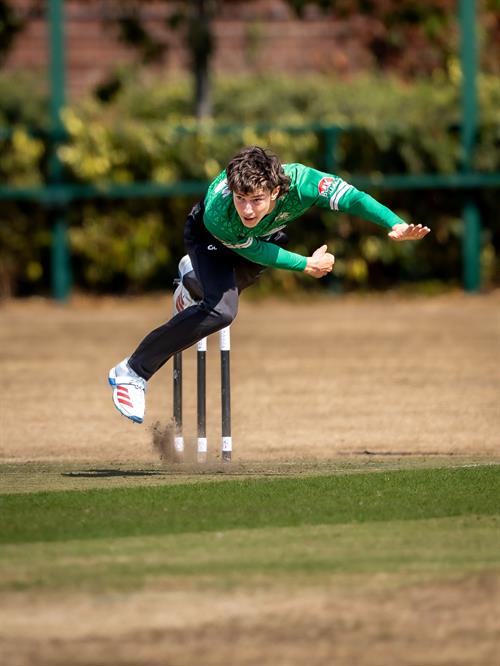 Archie Dodds bowling for Buckinghamshire in the NCCA Dojo T20 Super 12s Eliminator against Wiltshire at Exeter Cricket Club on August 9th, 2026.