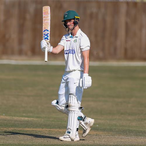 Alex Peirson acknowledges his half century on the way to 122 for Cambridgeshire in the first innings against Buckinghamshire in the NCCA Cluberly Championship, Eastern Division 1 match, held at Chesham CC on 10/08/2025 .