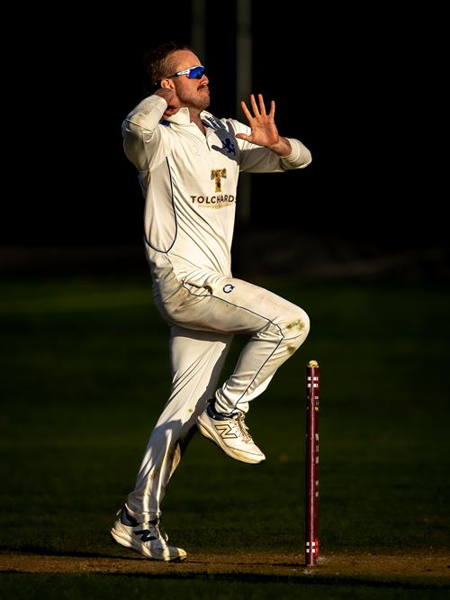Devon's Sam Read bowls in the late evening sunlight of the third day of the NCCA Cluberly Championship Final against Buckinghamshire held at West Bromwich Dartmouth Cricket Club from September 6th–9th, 2026.