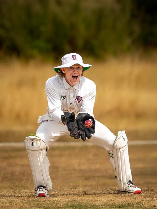 Luke Powell keeping wicket for Herefordshire on the first day of the NCCA Cluberly Championship match against Oxfordshire held at Thame Town Cricket Club from August 16th–18th, 2026.