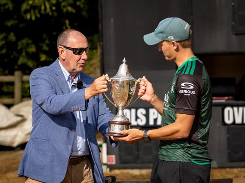 NCCA Chairman Martin Darlow (left) presents the NCCA Trophy to Andy Rishton after Berkshire defeated Cheshire by 112 runs in the Final at Copdock and Old Ipswichian Cricket club on July 19th, 2026. 