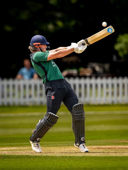 Cumbria's Louis Backhouse hits a six from the final ball of the innings in the first of two NCCA Dojo T20 matches against Cheshire at Nantwich Cricket Club on June 21st, 2026.