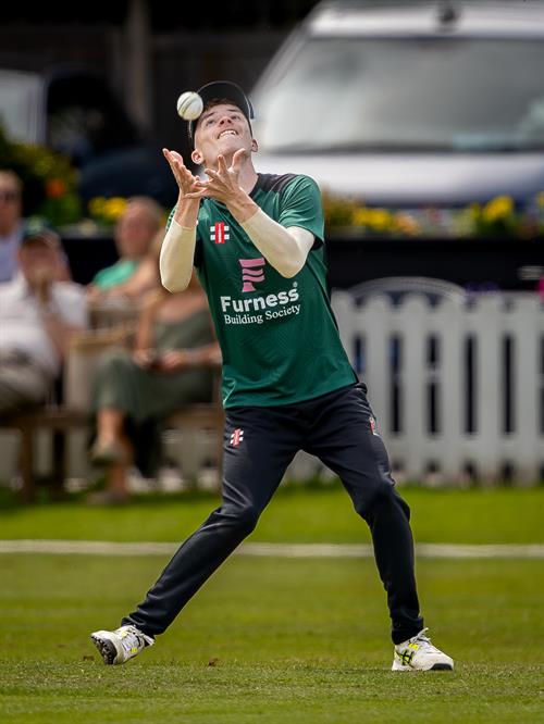 Cumbria's Kian Larmour taking the catch which dismissed Cheshire's Sam Perry in the second of two NCCA Dojo T20 matches at Nantwich Cricket Club on June 21st, 2026. 