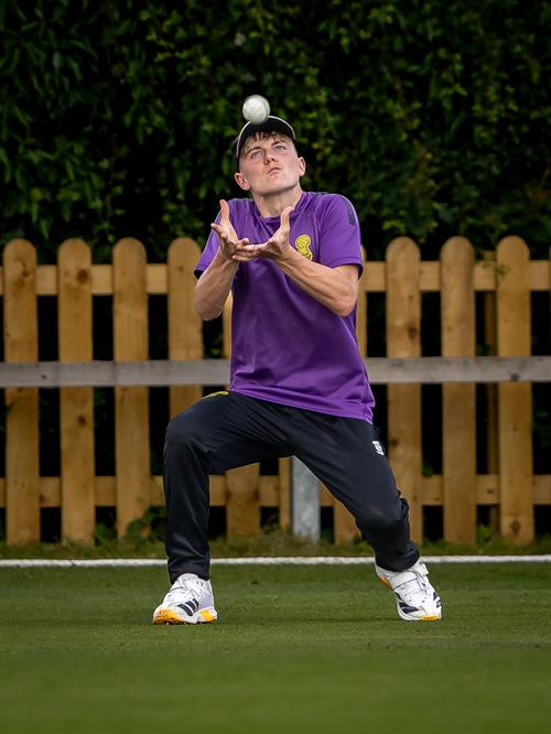 Cheshire's Zach Thompson taking the catch which dismissed Cumbria's Tom Fraine in the second of two NCCA Dojo T20 matches at Nantwich Cricket Club on June 21st, 2026.