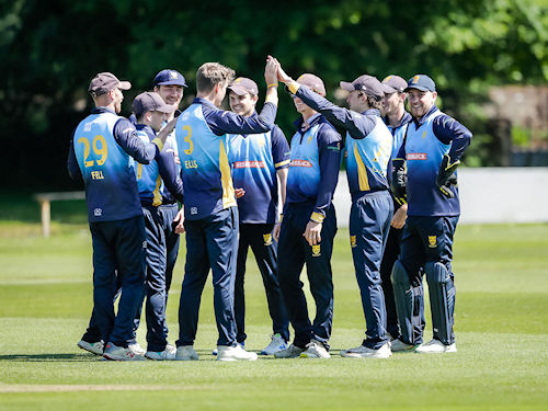 The Shropshire team celebrating after Sam Ellis took the first wicket in the NCCA Trophy match against Suffolk at Shifnall Cricket Club on June 2nd, 2024.